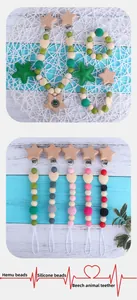 Detail of wooden beech and silicone beads for baby teething chain and star ring set