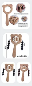 Detail showing natural beech wood bear baby rattle with safe silicone beads for DIY teething