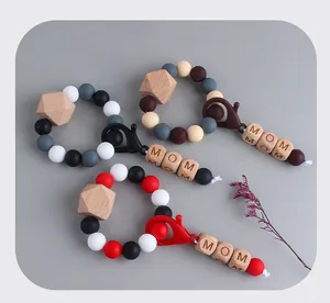 Detail of DIY Mom silicone bead keychain with beech wood beads and lobster clasp