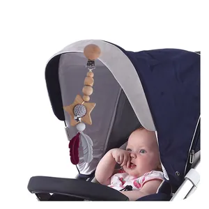 Silicone feather and wooden star baby stroller charm with bells and pacifier clip