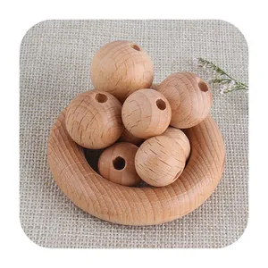Natural beech wood rings and beads for DIY pacifier clips and teething toys on burlap