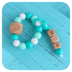 DIY silicone bead bracelet with MOM wooden cubes, lobster clasp, and beech wood beads