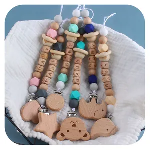 Baby Schnullerketten aus Buchenholz und Silikonperlen mit Tiermotiven und BABY-Buchstaben