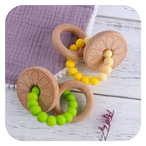 Baby teething ring made of natural beech wood and food-grade silicone beads in soft colors