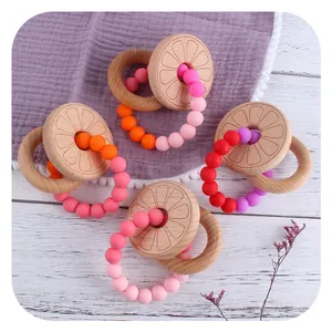 DIY beech wood and silicone baby teether rings with colorful beads in a 4-pack set