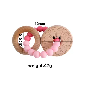 Baby beech wood teether ring with gradient pink silicone beads and lemon texture engraving
