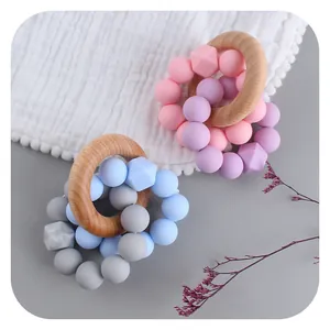 Octagonal silicone and beech wood baby teether bracelet for soothing and motor training