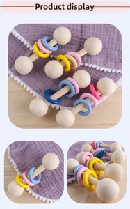 Detailed macro view of wooden baby rattles with smooth colorful rings for sensory play
