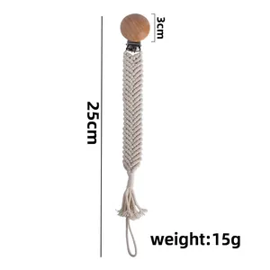 Handmade beech wood pacifier clip with cream woven cotton cord and tassel detail
