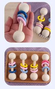 Detailed view of colorful wooden baby rattle with smooth rings and natural wood textures