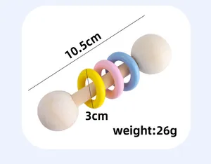 Detailed view of 10.5cm wooden baby rattle showing dimensions and weight metrics
