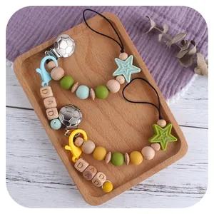 Silicone and beech wood baby pacifier clip with football metal clip and DAD wooden beads