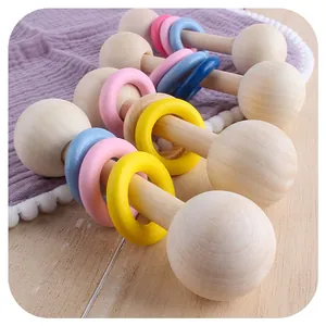 Handcrafted wooden baby rattle with colorful rings for sensory play and teething