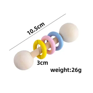 Handcrafted wooden baby rattle toy with colorful rings, measuring 10.5cm and 26g weight