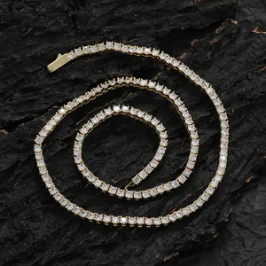 Macro shot of gold-plated tennis chain with prong-set zircons on a dark bark backdrop