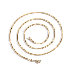 Detailed view of a 2mm gold-plated stainless steel chain with secure lobster clasp