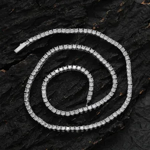 Macro shot of silver-toned tennis chain with sparkling cubic zirconia on dark texture