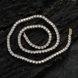 Detailed close-up of golden tennis chain with sparkling round-cut cubic zirconia crystals