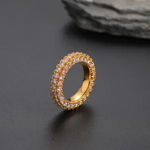 Macro side view of hip hop ring with three rows of pavé set white zircon stones