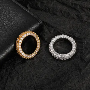 Detail of hip-hop rings with multi-layer pave zircon crystals in gold and silver