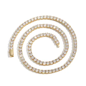 Macro view of gold tennis chain showing round cubic zirconia stones and box clasp