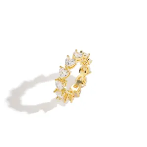 Detailed view of heart-shaped white zircons pave-set in a gold plated eternity ring