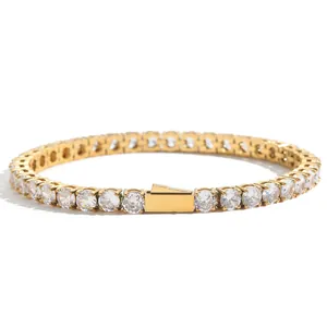 Macro shot of 4mm gold tennis bracelet with cubic zirconia and a secure spring clasp