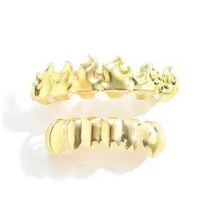 Macro detail of hip hop gold plated flame grillz set with polished metallic finish