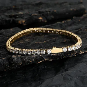 Detail view of gold tennis bracelet with cubic zirconia stones and secure box clasp