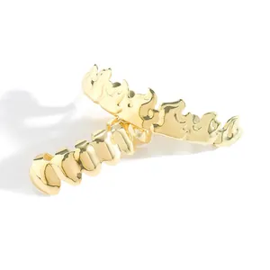 Hip hop style gold flame grillz set with polished finish for upper and lower teeth
