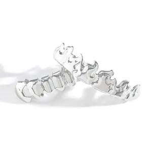Close-up of hip hop silver flame grillz set with high-polish metallic finish details