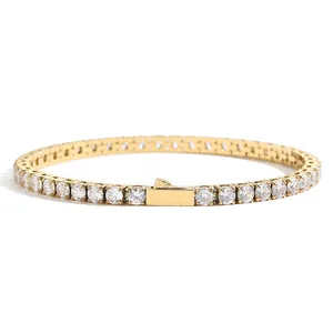 Detail of gold-plated tennis chain with round cubic zirconia stones and folding safety clasp