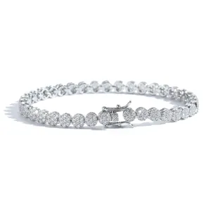 Detail view of 5mm tennis bracelet with round cluster zircon stones and double safety clasp
