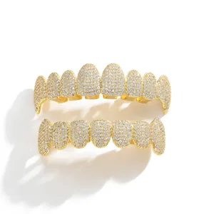 Macro shot of hip hop gold plated grillz set with micro paved sparkling zircons
