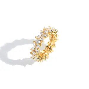 Macro detail of gold plated flower ring featuring marquise and round cut zircon stones