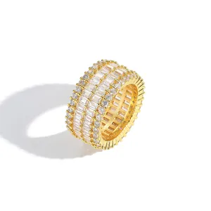 Close-up of gold plated ring featuring multi-row rectangular and round zircon stones