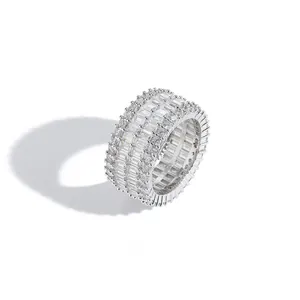 Hip hop silver color ring with baguette and round cut zircons in a multi-row pave setting