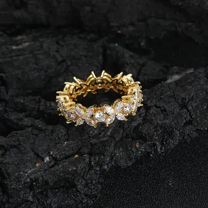 Iced-out flower ring with marquise and round cubic zirconia set in gold copper band