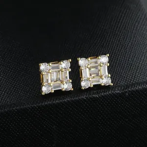 Square gold stud earrings with cubic zirconia inlay shown in a close-up profile view
