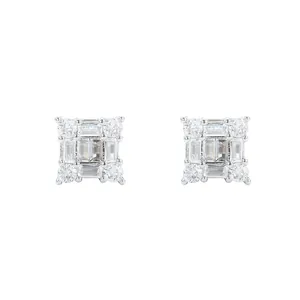 Macro shot of silver square stud earrings featuring baguette and round cut zircons
