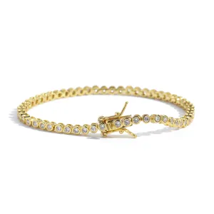 Golden 2mm bezel-set tennis bracelet with round cubic zirconia and secure box clasp