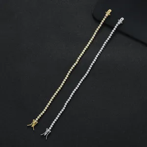 Single row 2mm tennis bracelet in gold and silver finish with cubic zirconia stones