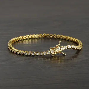 Close-up of 2mm tennis bracelet with gold plating and secure double safety clasp