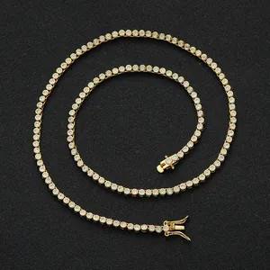 2mm gold tennis necklace with single row cubic zirconia stones on black background