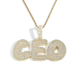 Detail of gold-plated CEO pendant with pave-set cubic zirconia on rope chain