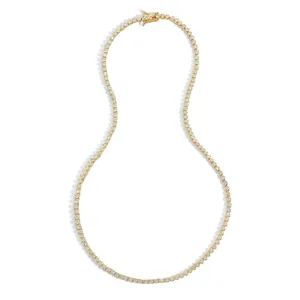 Detail of 2mm gold-plated tennis necklace with bezel-set stones and secure box clasp