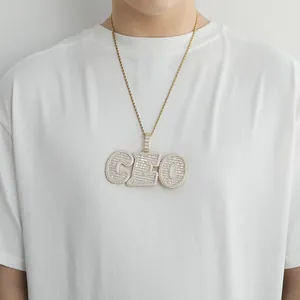 Iced-out gold CEO letter pendant with zircon inlay on a durable rope chain for men