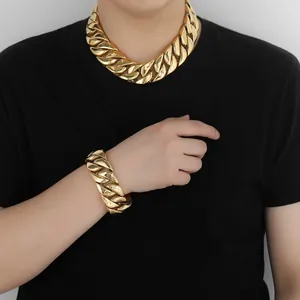 Detailed view of the gold-plated Cuban chain necklace and bracelet on a model
