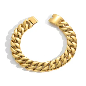 Detail of heavy polished gold Cuban link chain with secure mechanical clasp closure