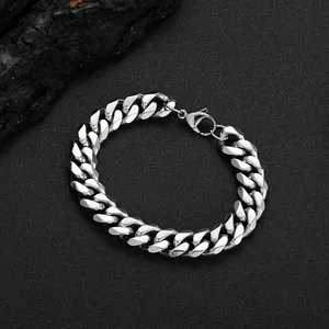 Detail of 12mm silver stainless steel Cuban link bracelet with a lobster clasp closure